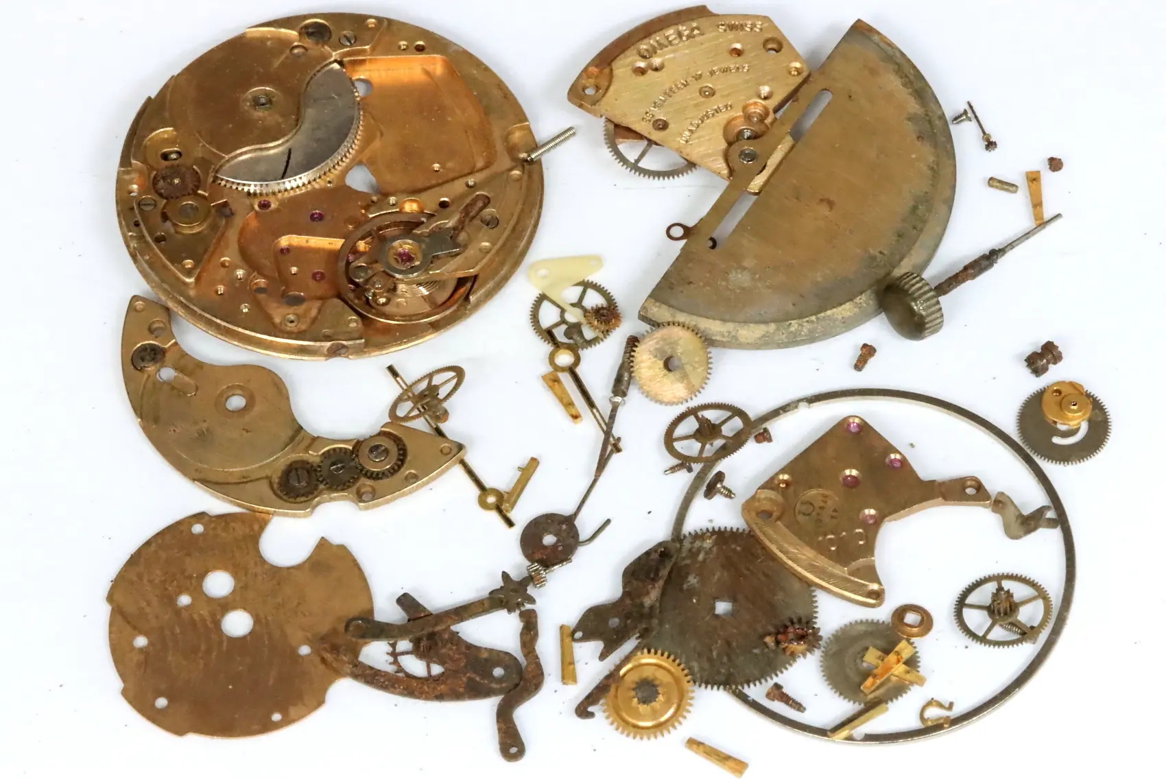 Omega 1010 mixed movement parts with corrosion and sold as is